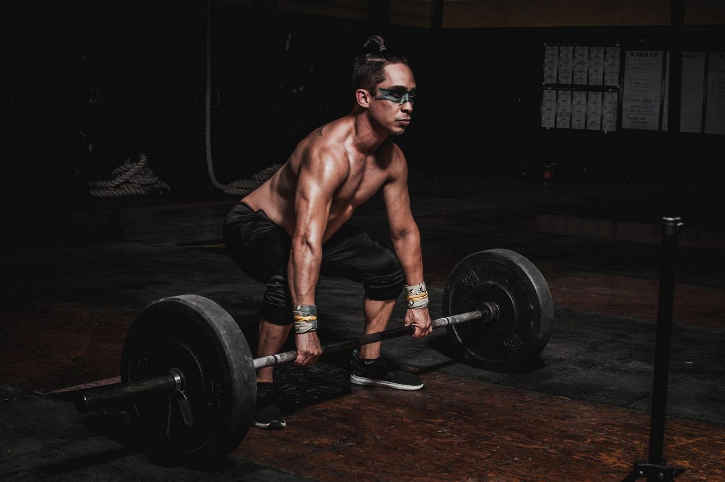 Athlete lifting heavy barbell